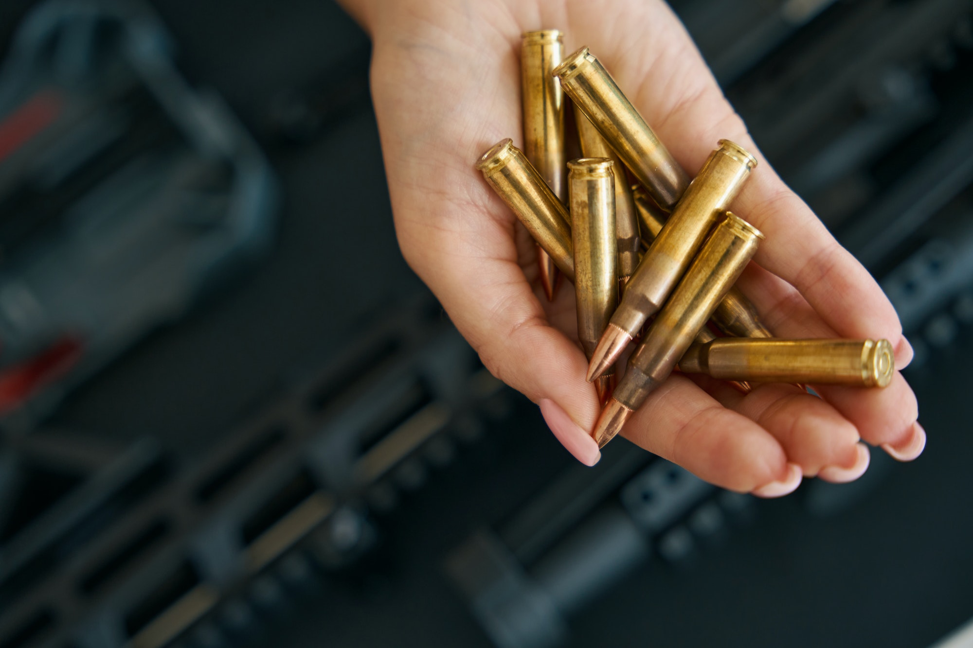 Combat cartridges on a tender female palm